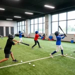 Young athletes at hitclub training facility practicing batting techniques in an inspiring atmosphere.